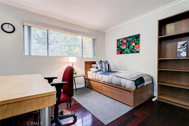 bedroom featuring crown molding and dark hardwood / wood-style flooring