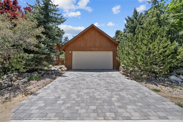 14329 Voltaire Dr, Pine Mountain Club, CA 93225 - garage featuring decorative driveway