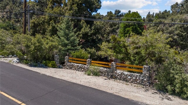 14329 Voltaire Dr, Pine Mountain Club, CA 93225 - exterior space with a view of trees and fence