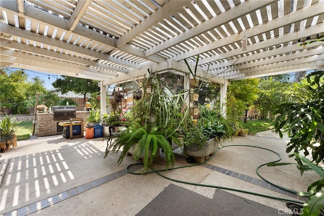 view of patio featuring a pergola and area for grilling