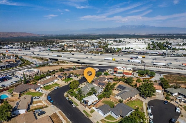 birds eye view of property featuring a mountain view