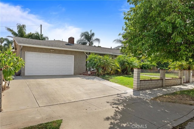 view of front of house featuring a front yard and a garage