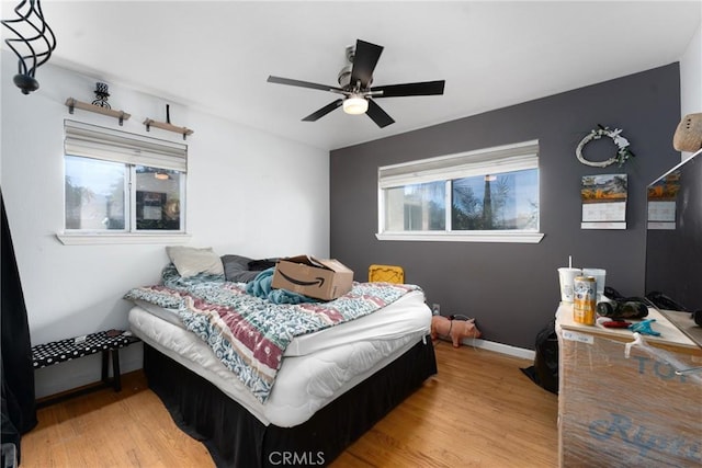 bedroom featuring hardwood / wood-style floors and ceiling fan