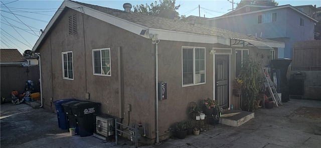 view of property exterior with a patio