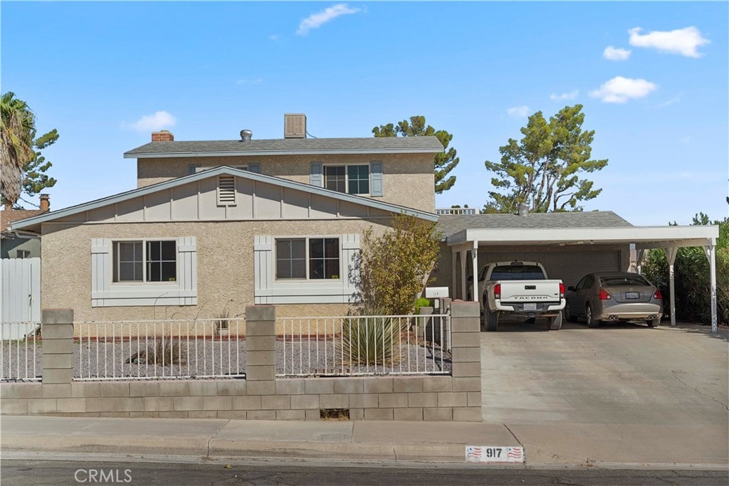 view of front of home featuring a carport