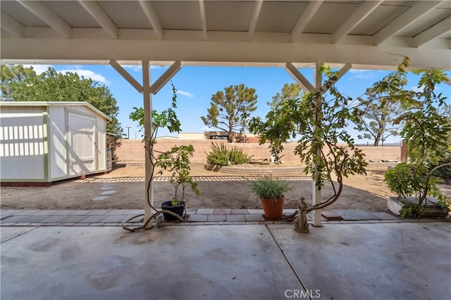 view of patio / terrace featuring a storage unit