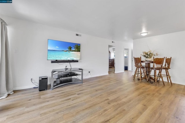 living room with light hardwood / wood-style flooring