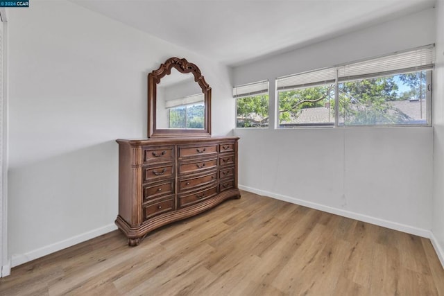 bedroom with light hardwood / wood-style flooring