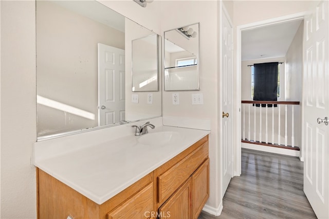 bathroom with vanity and wood-type flooring