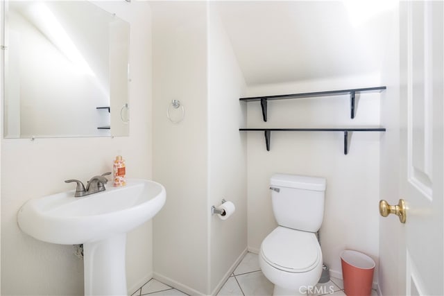 bathroom featuring toilet and tile patterned floors