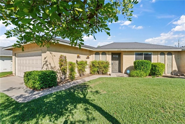 single story home featuring a garage and a front yard