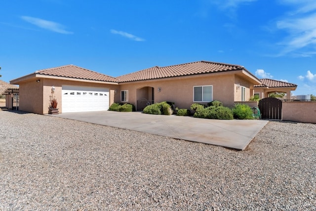 mediterranean / spanish-style home with a garage