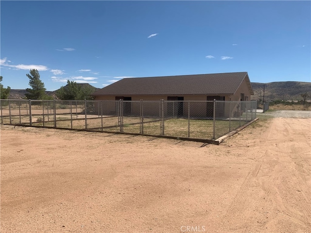 view of horse barn featuring a mountain view