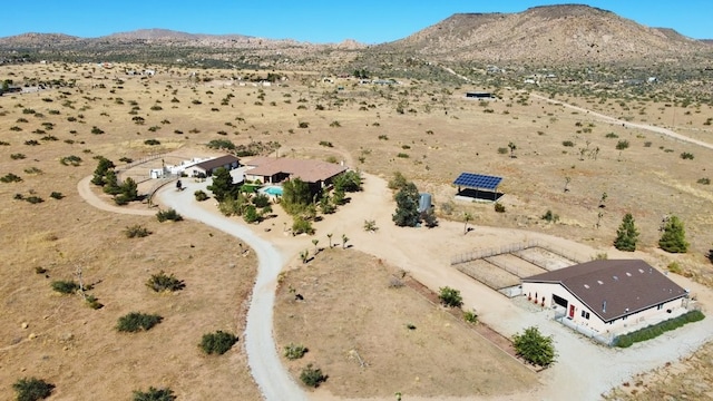 birds eye view of property featuring a mountain view