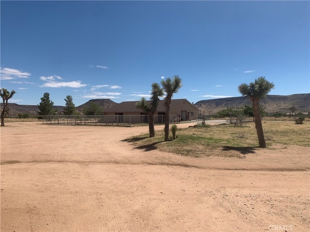 view of yard featuring a mountain view and a rural view