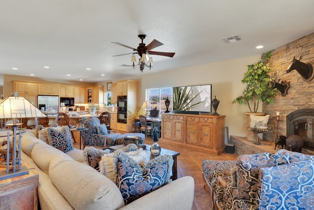 living room featuring light tile patterned flooring and ceiling fan