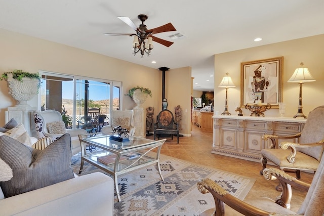 tiled living room featuring ceiling fan