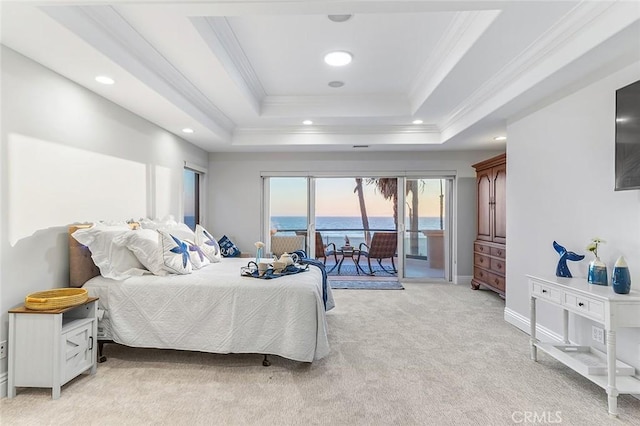 bedroom with access to exterior, light colored carpet, crown molding, and a raised ceiling