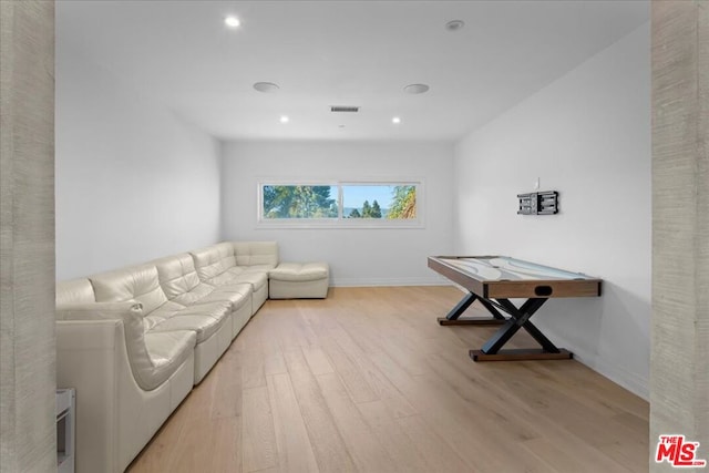 living room with light hardwood / wood-style floors