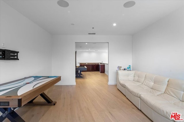 recreation room with light hardwood / wood-style floors and pool table