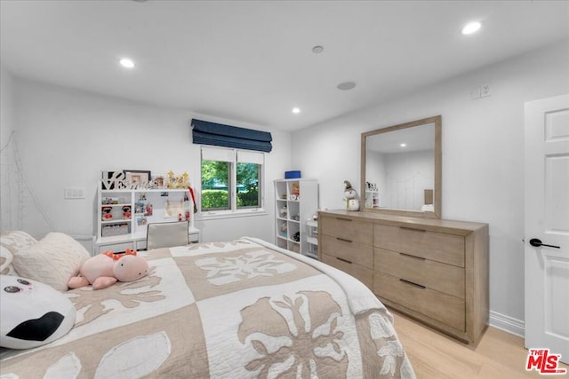 bedroom featuring light wood-type flooring