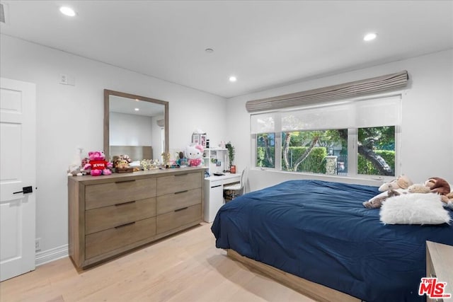 bedroom with light hardwood / wood-style floors