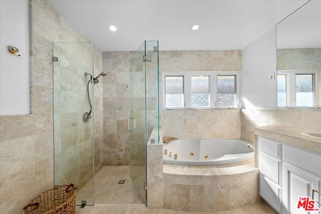 bathroom with vanity, independent shower and bath, and tile patterned floors