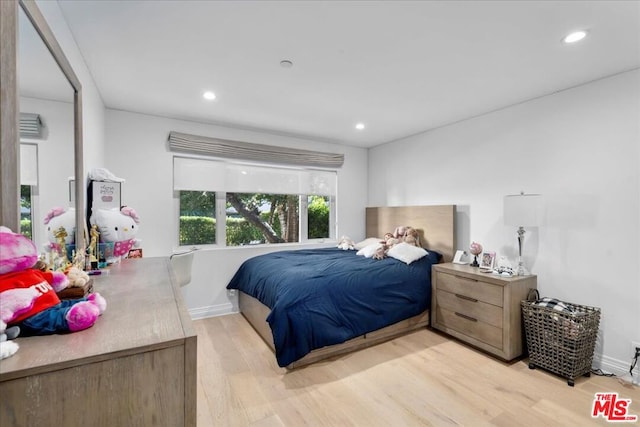 bedroom with light hardwood / wood-style flooring