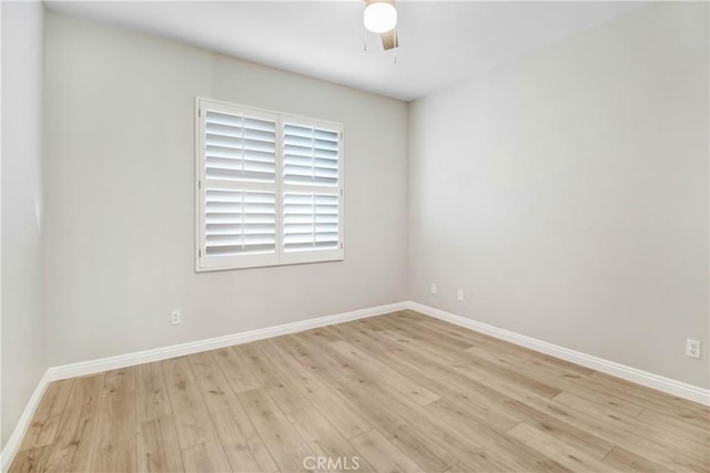 unfurnished room featuring light hardwood / wood-style floors and ceiling fan