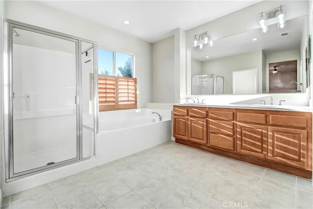 bathroom with separate shower and tub, tile patterned floors, and vanity