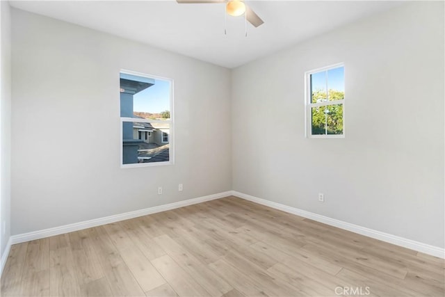 unfurnished room featuring light hardwood / wood-style flooring and ceiling fan