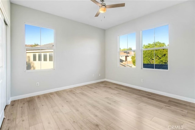 empty room with light wood-type flooring, plenty of natural light, and ceiling fan