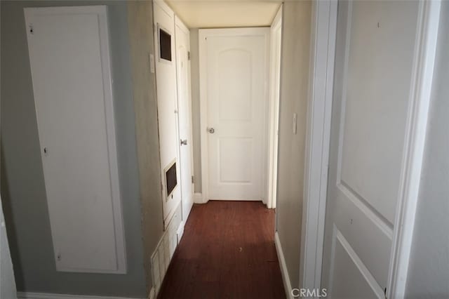 corridor with dark hardwood / wood-style floors