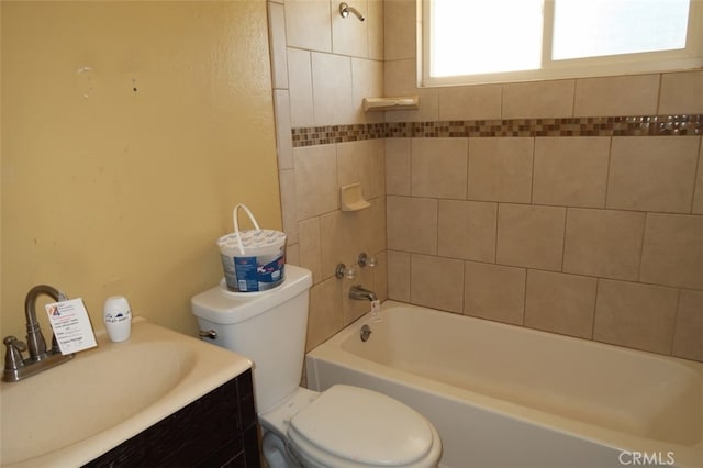 full bathroom with vanity, toilet, and tiled shower / bath