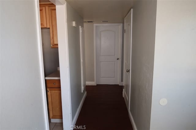 corridor featuring dark hardwood / wood-style floors