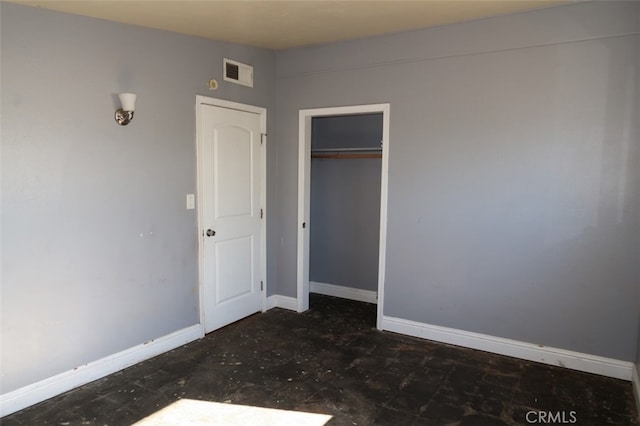 unfurnished bedroom with a closet