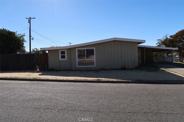 view of front of property featuring a carport