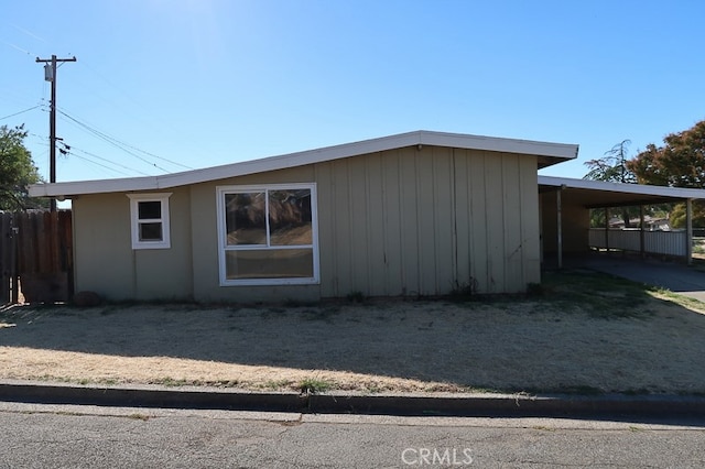 view of home's exterior with a carport