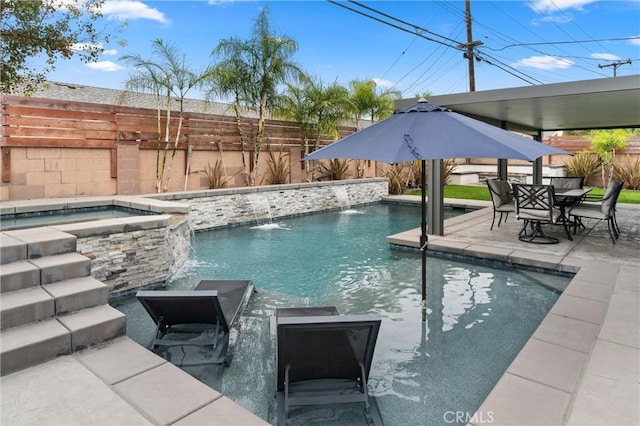 view of pool with pool water feature, an in ground hot tub, and a patio