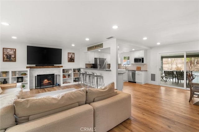 living room with light hardwood / wood-style floors