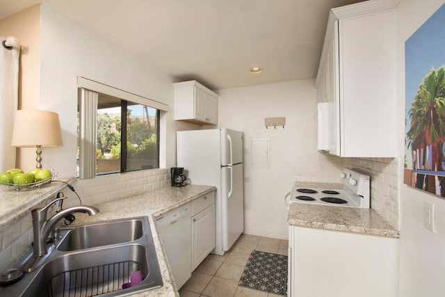 kitchen with decorative backsplash, white appliances, white cabinets, and sink