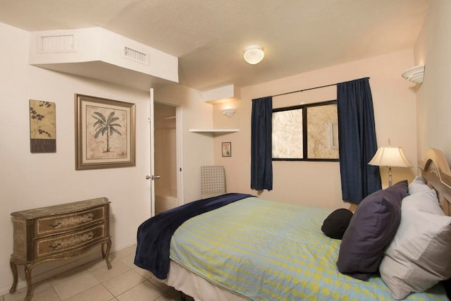 bedroom featuring light tile patterned flooring