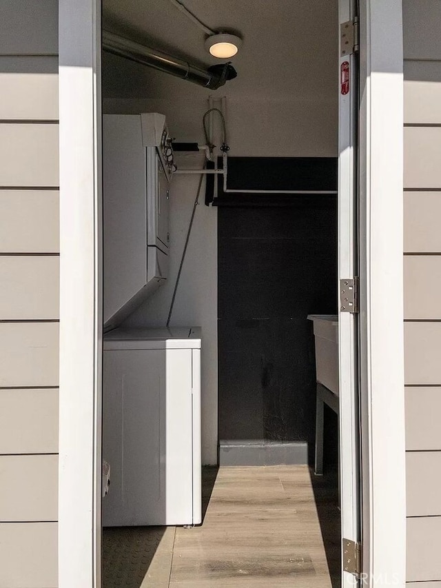 interior space featuring wood-type flooring and washer / clothes dryer