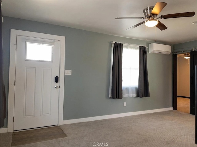 foyer entrance featuring light carpet, ceiling fan, and a wall unit AC