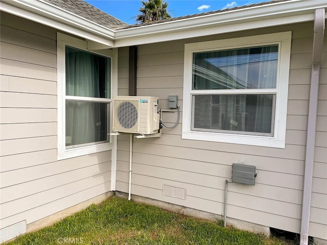 view of side of property featuring ac unit