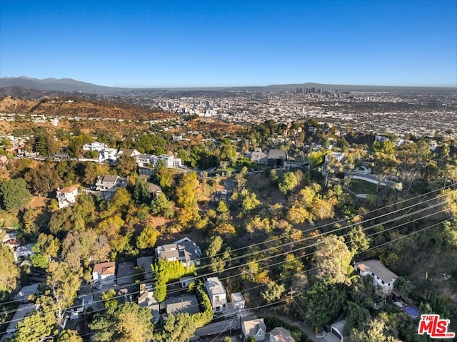 birds eye view of property with a mountain view