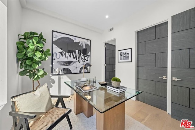 home office with light wood-type flooring