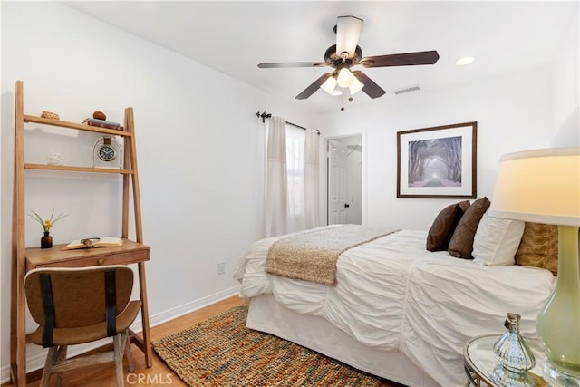 bedroom featuring ceiling fan and wood-type flooring