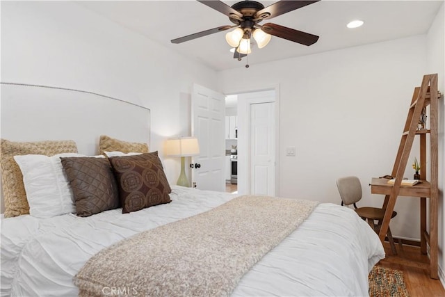 bedroom featuring ceiling fan and wood-type flooring