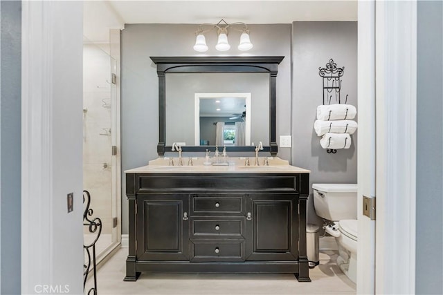 bathroom featuring ceiling fan, toilet, and vanity